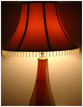 restored red lamp with wood base