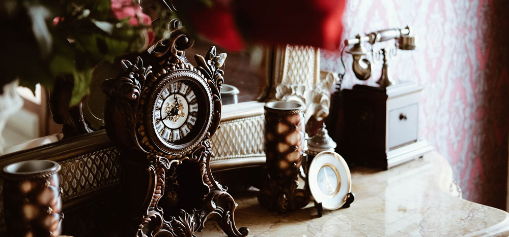 antique wooden clock on dresser